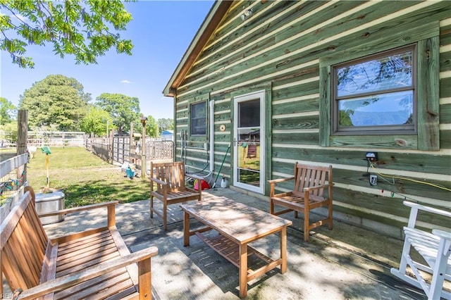 wooden terrace featuring a patio