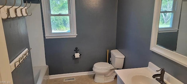 49 Church St, Poquoson, VA 23662 - full bathroom featuring tile patterned flooring, vanity, a shower, baseboards, and toilet