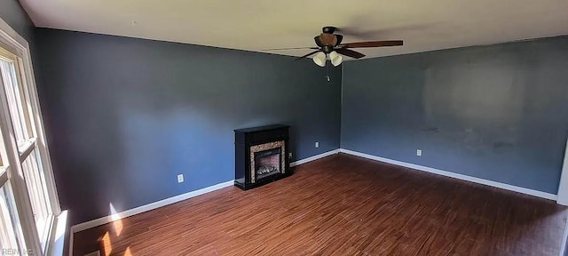 49 Church St, Poquoson, VA 23662 - unfurnished living room with ceiling fan, dark wood-style flooring, baseboards, and a fireplace
