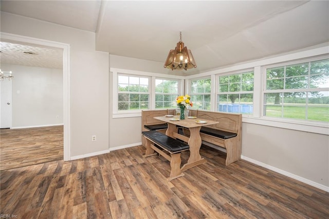 13542 Brink Rd, Emporia, VA 23847 - dining space featuring a chandelier, breakfast area, baseboards, and wood finished floors