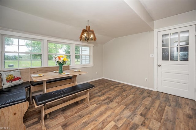 13542 Brink Rd, Emporia, VA 23847 - dining room featuring breakfast area, a chandelier, wood finished floors, baseboards, and lofted ceiling