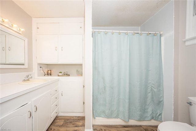 13542 Brink Rd, Emporia, VA 23847 - full bath with wood finished floors, vanity, and toilet