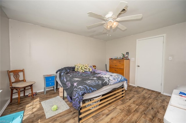 13542 Brink Rd, Emporia, VA 23847 - bedroom featuring wood finished floors, a ceiling fan, and baseboards