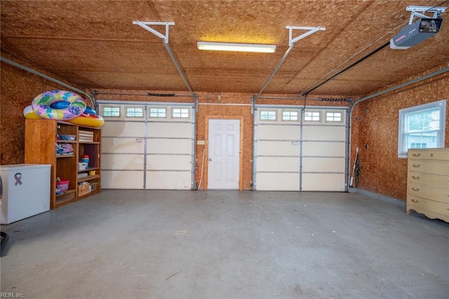 13542 Brink Rd, Emporia, VA 23847 - garage featuring fridge and a garage door opener