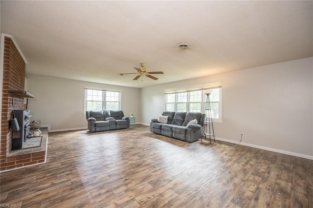 13542 Brink Rd, Emporia, VA 23847 - living area featuring a ceiling fan, wood finished floors, and baseboards