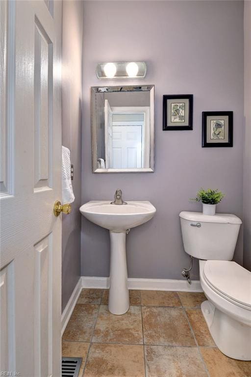 4901 Toddington Cir, Williamsburg, VA 23188 - bathroom featuring baseboards and toilet