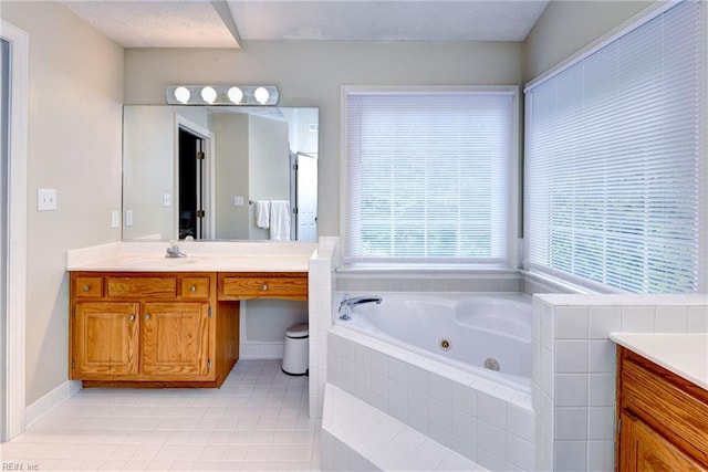 4901 Toddington Cir, Williamsburg, VA 23188 - bathroom with vanity, a jetted tub, and tile patterned floors