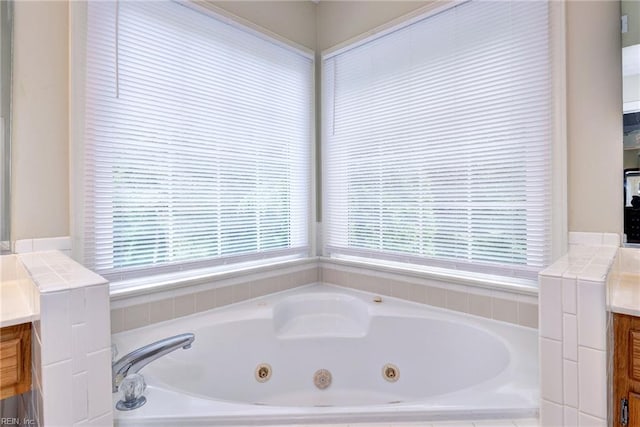 4901 Toddington Cir, Williamsburg, VA 23188 - bathroom featuring vanity, plenty of natural light, and a jetted tub