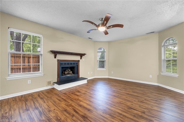5217 Bardith Cir, Virginia Beach, VA 23455 - unfurnished living room featuring wood finished floors, plenty of natural light, and a textured ceiling