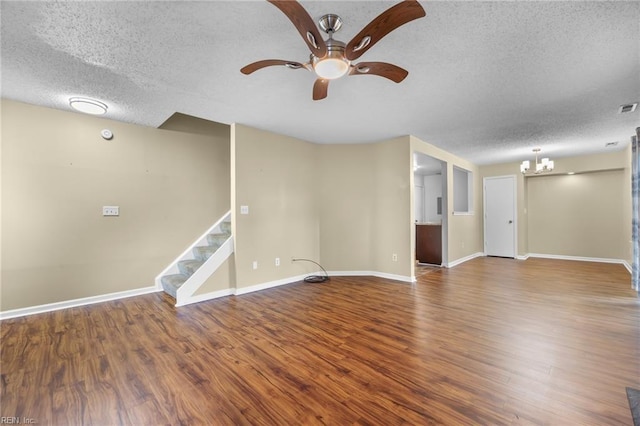 5217 Bardith Cir, Virginia Beach, VA 23455 - unfurnished living room featuring a textured ceiling, a ceiling fan, wood finished floors, a chandelier, and baseboards