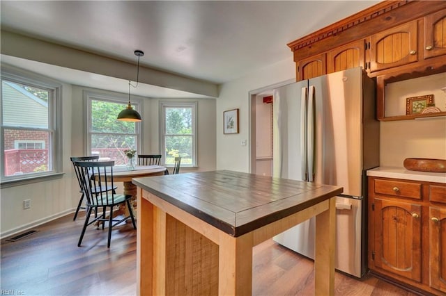 1305 Oak Ridge Dr, Chesapeake, VA 23322 - kitchen with freestanding refrigerator, wood finished floors, pendant lighting, and butcher block countertops