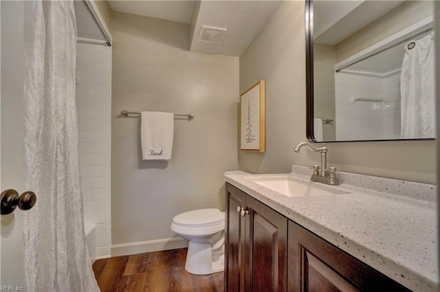 1305 Oak Ridge Dr, Chesapeake, VA 23322 - full bathroom featuring toilet, wood finished floors, vanity, baseboards, and shower / tub combo