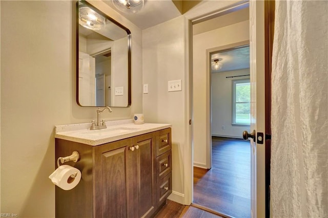 1305 Oak Ridge Dr, Chesapeake, VA 23322 - bathroom with wood finished floors, vanity, and baseboards