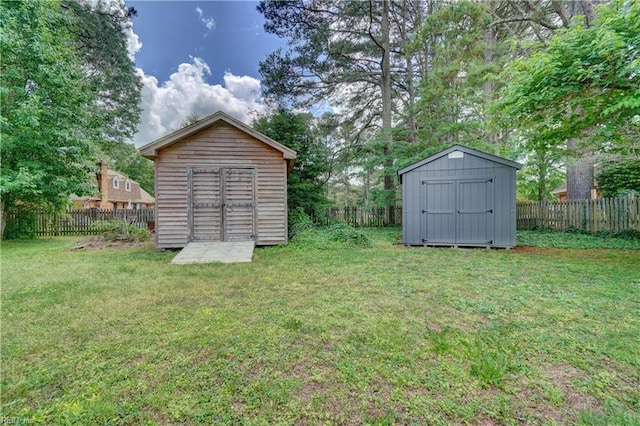 1305 Oak Ridge Dr, Chesapeake, VA 23322 - view of yard featuring a storage shed and an outbuilding