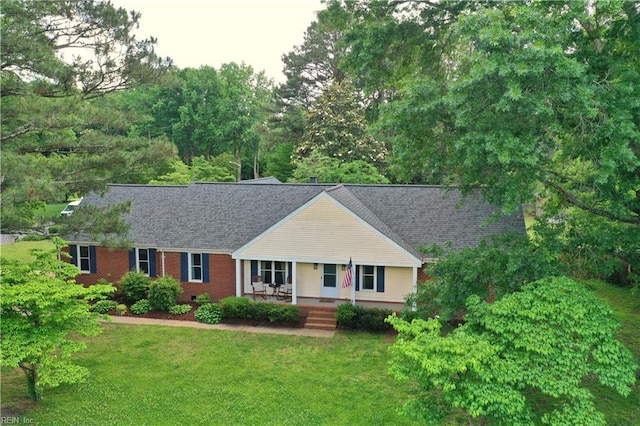 1305 Oak Ridge Dr, Chesapeake, VA 23322 - view of front of home featuring covered porch, a front lawn, and a shingled roof