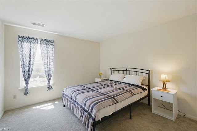 carpeted bedroom with baseboards