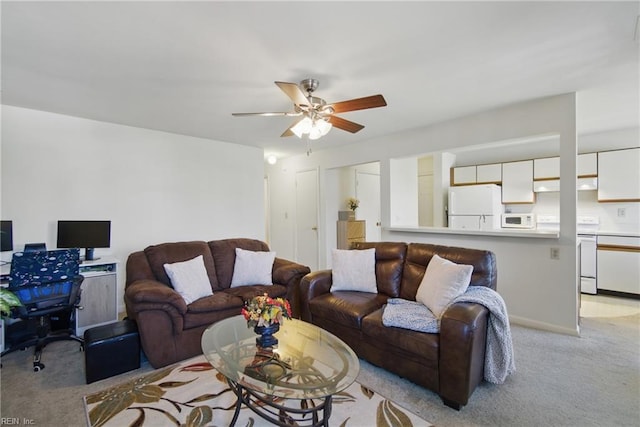 living room featuring light carpet and a ceiling fan