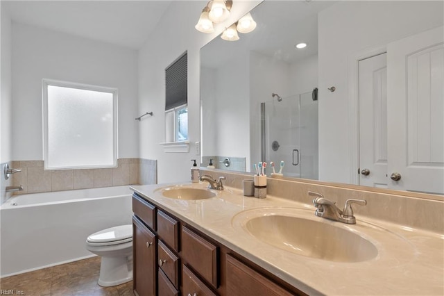 121 Algonquin Trl, Shawboro, NC 27973 - bathroom featuring a shower stall, a garden tub, double vanity, toilet, and tile patterned flooring