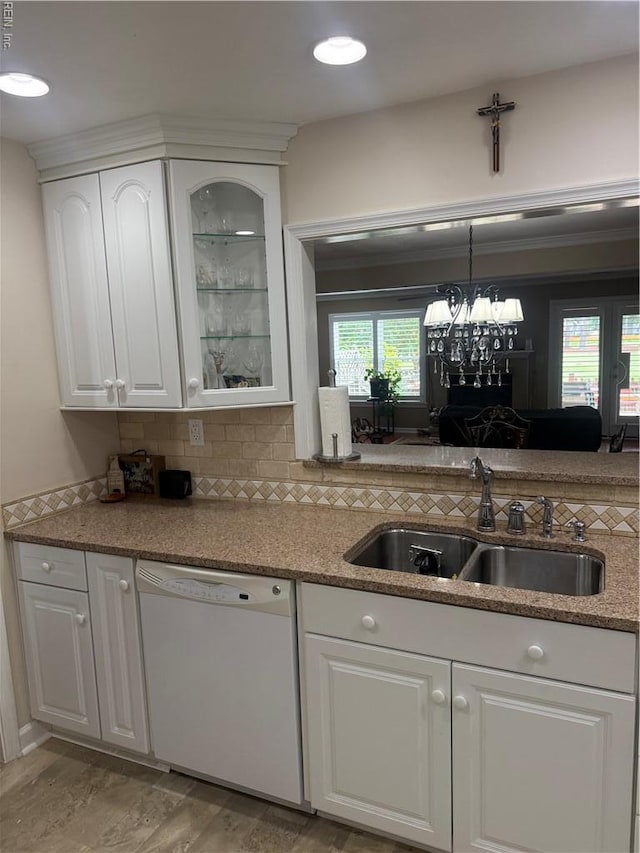 4705 Kempsville Green Parkway, Virginia Beach, VA 23462 - kitchen with white dishwasher, a sink, white cabinets, tasteful backsplash, and glass insert cabinets