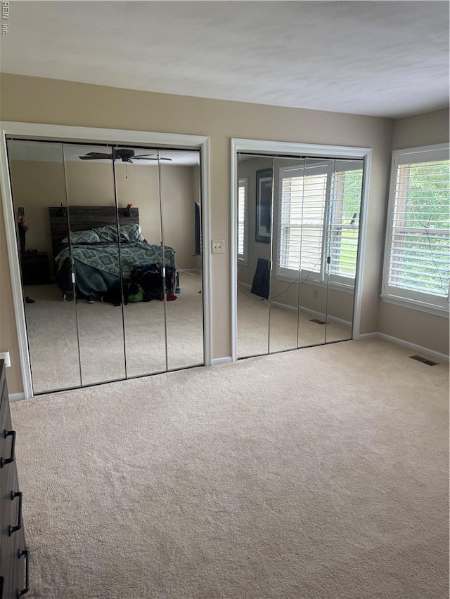 4705 Kempsville Green Parkway, Virginia Beach, VA 23462 - bedroom featuring carpet floors, multiple closets, and baseboards