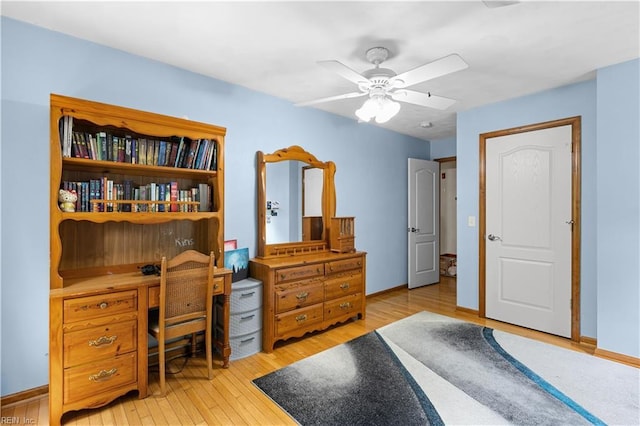 2740 Duckwood Ct, Suffolk, VA 23435 - bedroom with light wood-style flooring, a desk, baseboards, and a ceiling fan