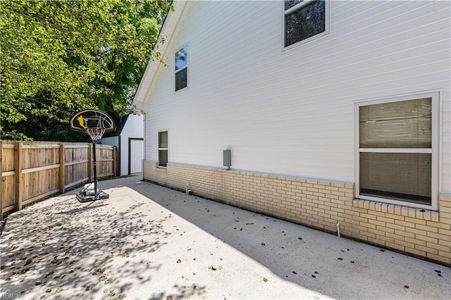 2740 Duckwood Ct, Suffolk, VA 23435 - view of property exterior with brick siding, fence, and a patio area