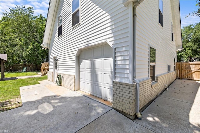 2740 Duckwood Ct, Suffolk, VA 23435 - view of side of property featuring a garage and brick siding