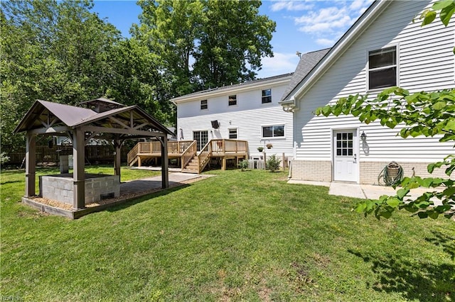 2740 Duckwood Ct, Suffolk, VA 23435 - rear view of house with a gazebo, a yard, and a wooden deck