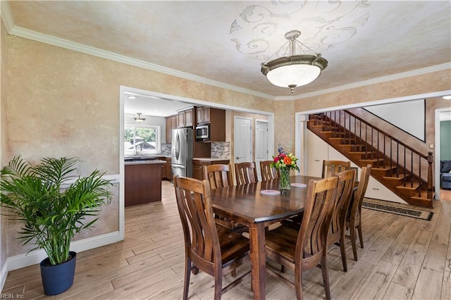 2740 Duckwood Ct, Suffolk, VA 23435 - dining space featuring light wood finished floors, stairs, and baseboards