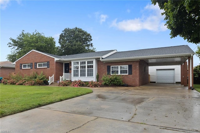 single story home with brick siding, a front yard, an attached garage, and driveway