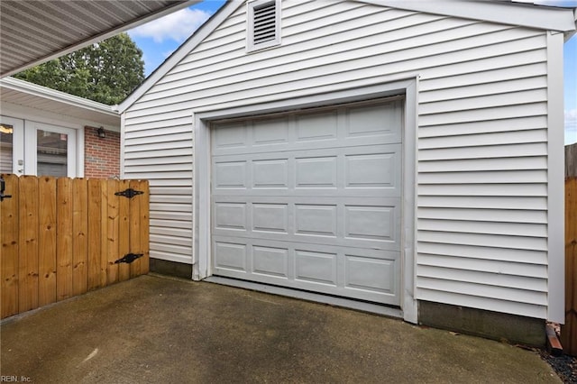 garage featuring driveway