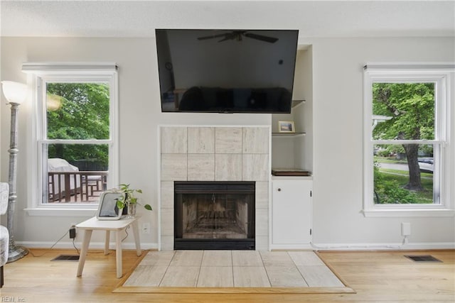 411 Rhode Island Ave, Norfolk, VA 23508 - living area with wood finished floors, a fireplace, baseboards, and built in features