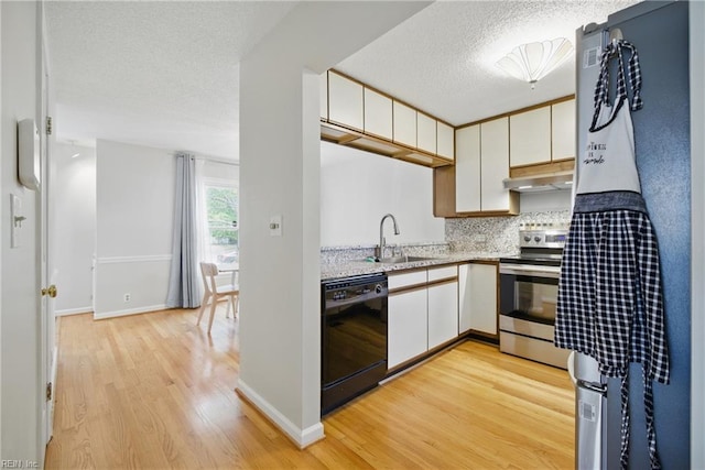 411 Rhode Island Ave, Norfolk, VA 23508 - kitchen with black dishwasher, stainless steel range with electric cooktop, a sink, light wood-type flooring, and backsplash