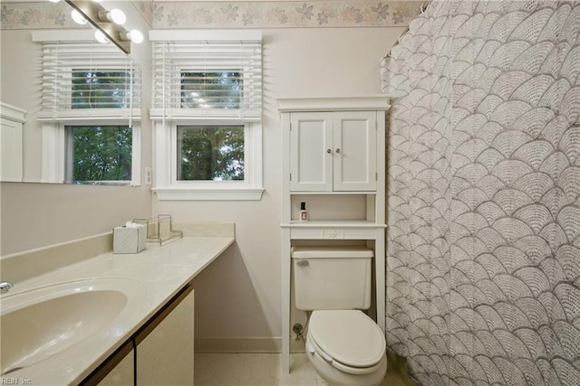 411 Rhode Island Ave, Norfolk, VA 23508 - bathroom featuring toilet, vanity, tile patterned floors, and baseboards