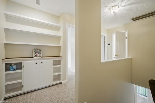411 Rhode Island Ave, Norfolk, VA 23508 - hall featuring a textured ceiling, light colored carpet, and baseboards