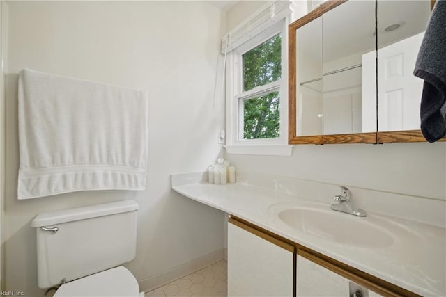 411 Rhode Island Ave, Norfolk, VA 23508 - bathroom featuring toilet, baseboards, and vanity