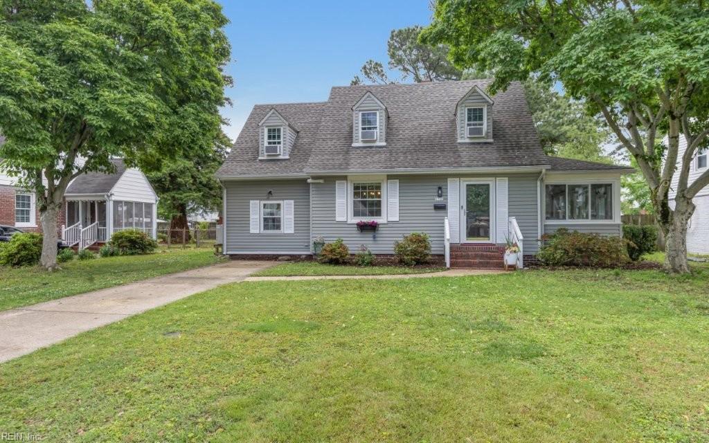 8718 Semmes Ave, Norfolk, VA 23503 - cape cod home with a front lawn, a shingled roof, a sunroom, and entry steps