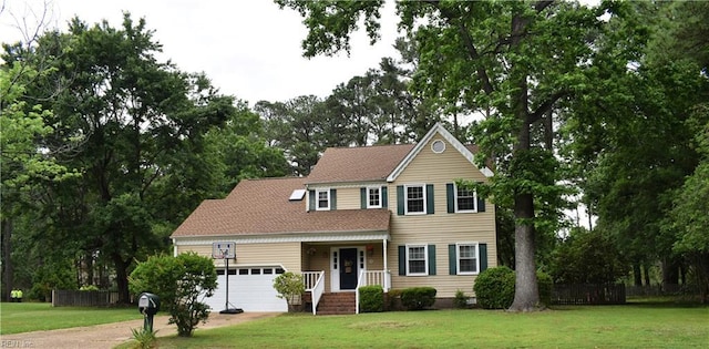 10 Thomas Dr, Poquoson, VA 23662 - view of front of home with an attached garage, view of scattered trees, and driveway