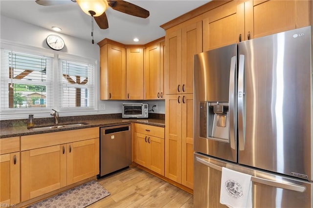216 Stubbs Dr, Chesapeake, VA 23323 - kitchen with stainless steel appliances, a sink, light wood-style flooring, ceiling fan, and dark stone counters