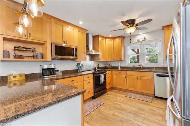 216 Stubbs Dr, Chesapeake, VA 23323 - kitchen with stainless steel appliances, wall chimney range hood, a sink, light wood-style flooring, and dark stone countertops