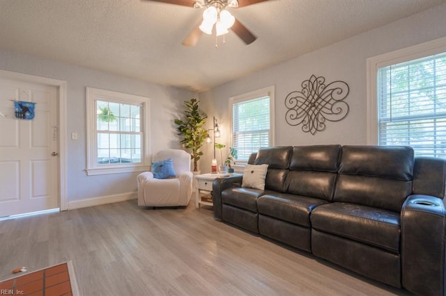 310 Manteo Ave, Hampton, VA 23661 - living area with wood finished floors, a ceiling fan, baseboards, and a textured ceiling