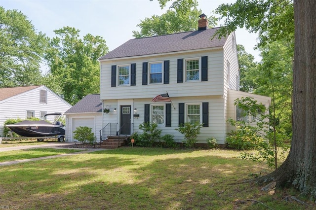 310 Manteo Ave, Hampton, VA 23661 - colonial inspired home with a garage, a chimney, a front lawn, driveway, and roof with shingles