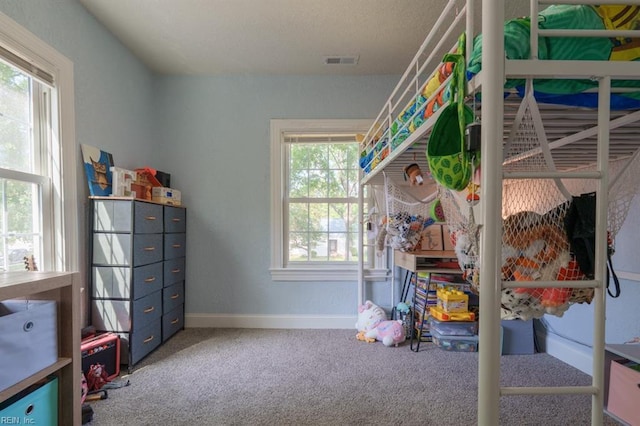 310 Manteo Ave, Hampton, VA 23661 - carpeted bedroom with multiple windows and baseboards
