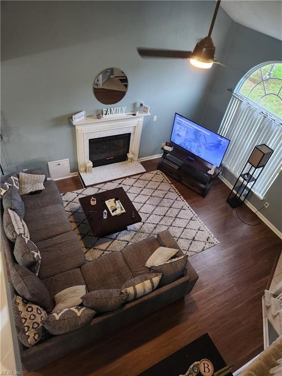 515 Burton St, Hampton, VA 23666 - living room featuring a premium fireplace, wood finished floors, vaulted ceiling, ceiling fan, and baseboards