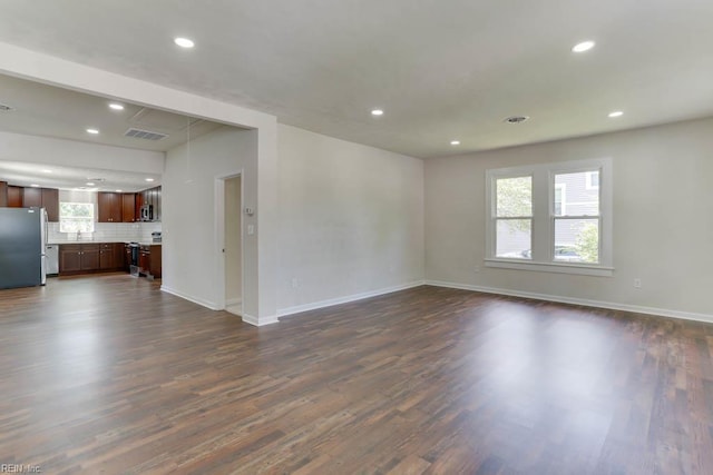 208 George Washington Hwy N, Chesapeake, VA 23323 - unfurnished living room with plenty of natural light, dark wood-style flooring, recessed lighting, and baseboards