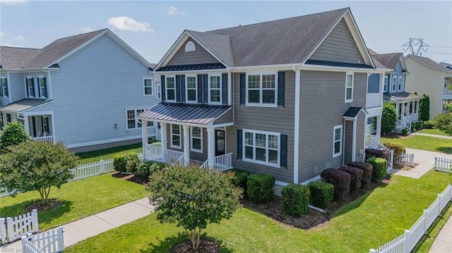 3217 Meanley Dr, Chesapeake, VA 23323 - view of property with a standing seam roof, a porch, and metal roof