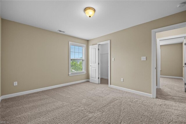 3217 Meanley Dr, Chesapeake, VA 23323 - unfurnished bedroom featuring carpet floors, baseboards, a spacious closet, and a closet