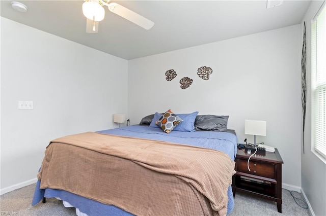 bedroom with carpet floors, baseboards, and a ceiling fan