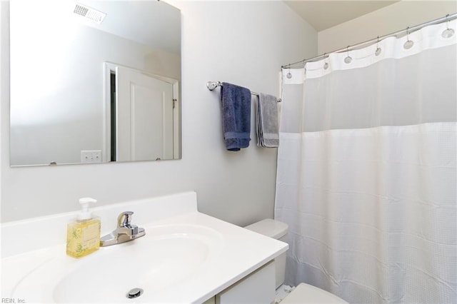 full bathroom featuring toilet and vanity