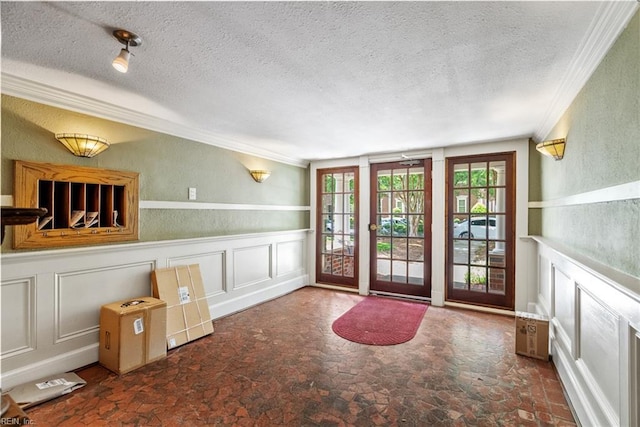 1506 Colonial Ave Unit 9, Norfolk, VA 23517 - foyer entrance with crown molding, a textured ceiling, stone finish floors, a decorative wall, and wainscoting